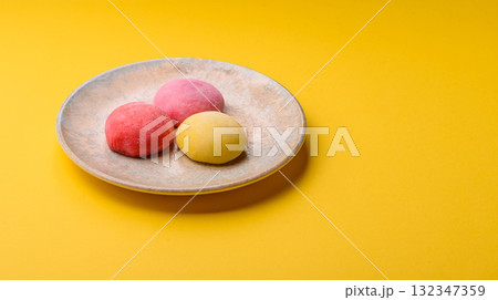 Japanese mochi, ice cream or Asian sweets with fruit filling. Mochi of different colors 132347359