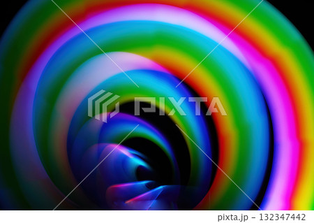 Colorful Spiral Illusion. A mesmerizing spiral featuring vibrant, swirling colors with a hypnotic effect. Colorful Spiral Illusion. A mesmerizing spiral featuring vibrant, swirling colors with a hypnotic effect. 132347442
