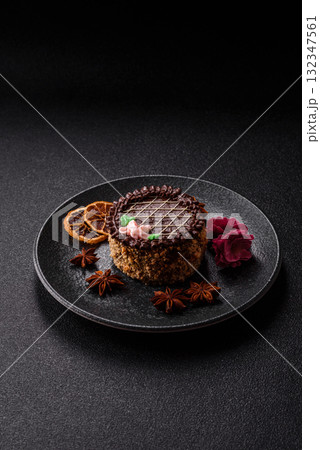Sweet tart, pie with chocolate and cream with fruit filling on a plate. Chocolate tart Sweet tart, pie with chocolate and cream with fruit filling on a plate. Chocolate tart 132347561