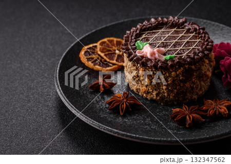 Sweet tart, pie with chocolate and cream with fruit filling on a plate. Chocolate tart Sweet tart, pie with chocolate and cream with fruit filling on a plate. Chocolate tart 132347562