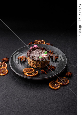 Sweet tart, pie with chocolate and cream with fruit filling on a plate. Chocolate tart 132347573