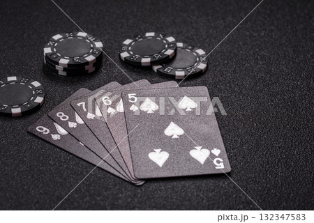 Playing card game poker in casino with chips, bets and risk. Cards and chips 132347583