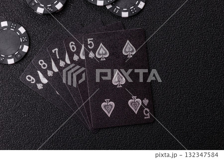 Playing card game poker in casino with chips, bets and risk. Cards and chips 132347584