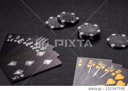 Playing card game poker in casino with chips, bets and risk. Cards and chips 132347598