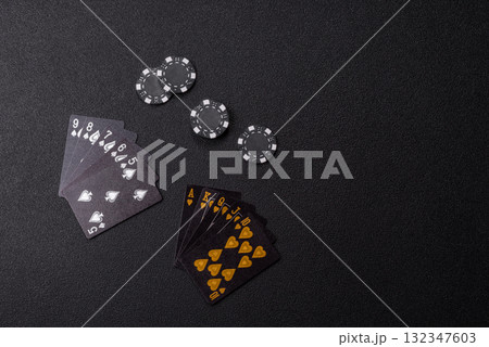 Playing card game poker in casino with chips, bets and risk. Cards and chips Playing card game poker in casino with chips, bets and risk. Cards and chips 132347603