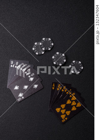 Playing card game poker in casino with chips, bets and risk. Cards and chips Playing card game poker in casino with chips, bets and risk. Cards and chips 132347604