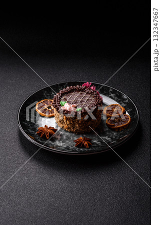 Sweet tart, pie with chocolate and cream with fruit filling on a plate. Chocolate tart Sweet tart, pie with chocolate and cream with fruit filling on a plate. Chocolate tart 132347667