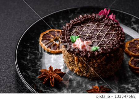 Sweet tart, pie with chocolate and cream with fruit filling on a plate. Chocolate tart 132347668