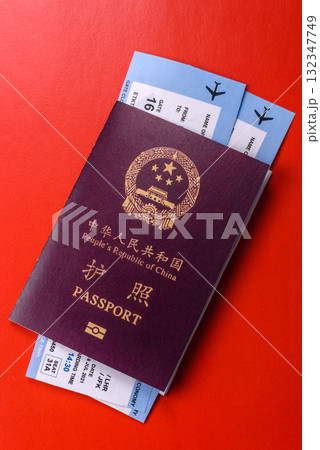 China, Chinese passport with money and flight tickets. Chinese passport with tickets 132347749