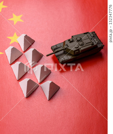 Anti-tank barrier or dragon's teeth made of concrete and iron as a fortification. Dragon's teeth Anti-tank barrier or dragon's teeth made of concrete and iron as a fortification. Dragon's teeth 132347776