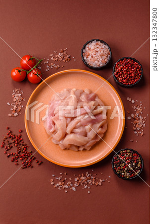 Raw chicken meat cut into strips, fresh fillet or breast slices. Chicken raw meat in pieces Raw chicken meat cut into strips, fresh fillet or breast slices. Chicken raw meat in pieces 132347800