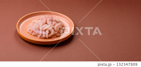 Raw chicken meat cut into strips, fresh fillet or breast slices. Chicken raw meat in pieces 132347809