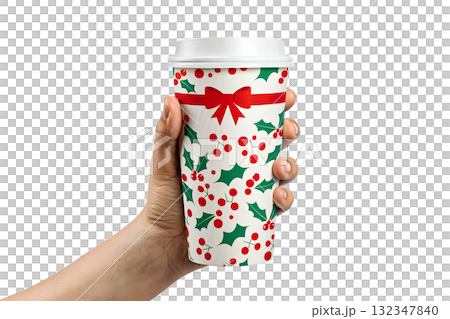 Hand holding festive christmas coffee cup with holly berry and leaf design, seasonal beverage isolated on transparent background 132347840