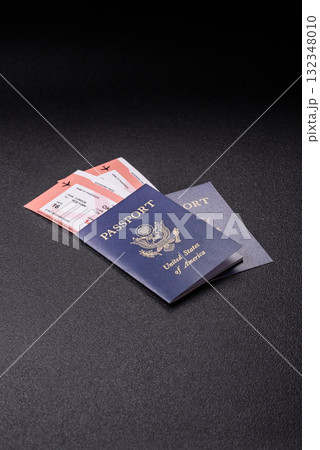 US passport or id document with tickets for flight, travel, border crossing. US passport and tickets 132348010