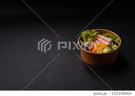 Bowl with shrimps, seafood, rice, oranges, tomatoes with sauce. Bowl with prawns Bowl with shrimps, seafood, rice, oranges, tomatoes with sauce. Bowl with prawns 132348064