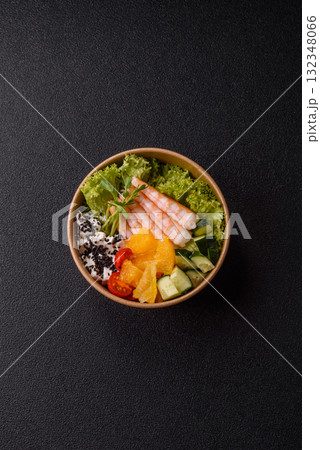 Bowl with shrimps, seafood, rice, oranges, tomatoes with sauce. Bowl with prawns Bowl with shrimps, seafood, rice, oranges, tomatoes with sauce. Bowl with prawns 132348066