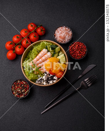 Bowl with shrimps, seafood, rice, oranges, tomatoes with sauce. Bowl with prawns Bowl with shrimps, seafood, rice, oranges, tomatoes with sauce. Bowl with prawns 132348078