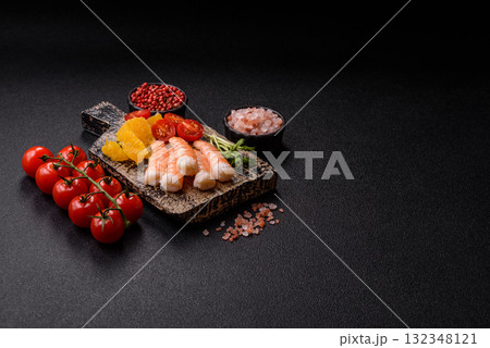 Bowl with shrimps, seafood, rice, oranges, tomatoes with sauce. Bowl with prawns 132348121