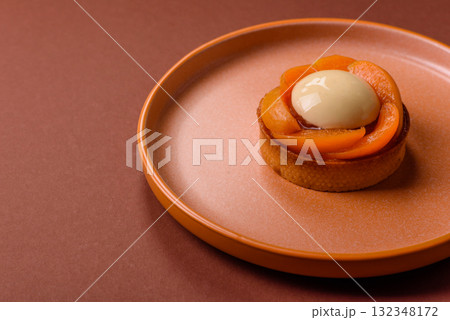 Pie, sweet round tart with apricot pieces, cream and nuts. Sweet tart with peach Pie, sweet round tart with apricot pieces, cream and nuts. Sweet tart with peach 132348172