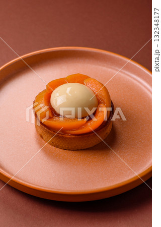 Pie, sweet round tart with apricot pieces, cream and nuts. Sweet tart with peach Pie, sweet round tart with apricot pieces, cream and nuts. Sweet tart with peach 132348177