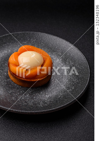 Pie, sweet round tart with apricot pieces, cream and nuts. Sweet tart with peach 132348196