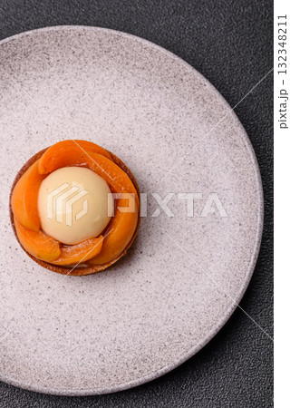 Pie, sweet round tart with apricot pieces, cream and nuts. Sweet tart with peach Pie, sweet round tart with apricot pieces, cream and nuts. Sweet tart with peach 132348211