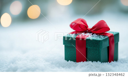 gift box on snow in winter with blur background 132348462
