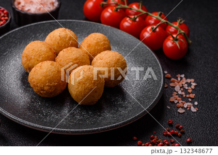 Cheese balls, croquettes or arancini with potatoes or rice. Cheese balls Cheese balls, croquettes or arancini with potatoes or rice. Cheese balls 132348677