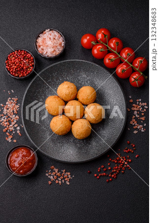 Cheese balls, croquettes or arancini with potatoes or rice. Cheese balls 132348683