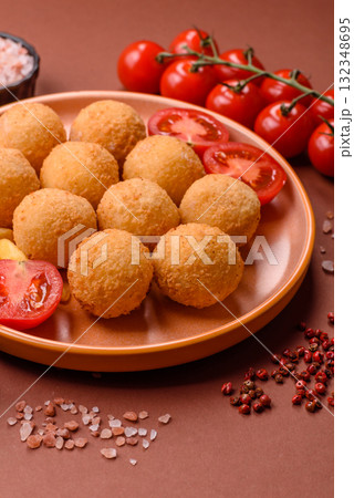 Cheese balls, croquettes or arancini with potatoes or rice. Cheese balls 132348695