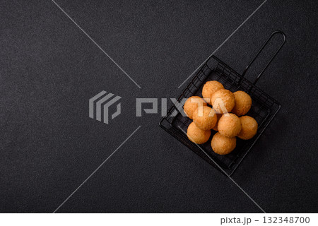 Cheese balls, croquettes or arancini with potatoes or rice. Cheese balls Cheese balls, croquettes or arancini with potatoes or rice. Cheese balls 132348700