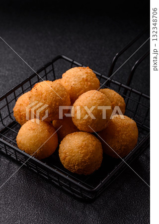 Cheese balls, croquettes or arancini with potatoes or rice. Cheese balls Cheese balls, croquettes or arancini with potatoes or rice. Cheese balls 132348706