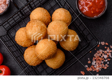 Cheese balls, croquettes or arancini with potatoes or rice. Cheese balls Cheese balls, croquettes or arancini with potatoes or rice. Cheese balls 132348708