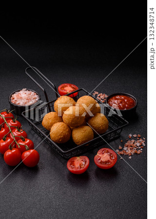 Cheese balls, croquettes or arancini with potatoes or rice. Cheese balls 132348714