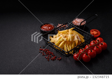 French fries, chips or snack with sauce as food background. French fries 132348715