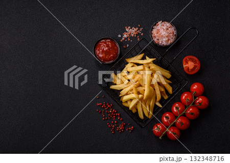 French fries, chips or snack with sauce as food background. French fries 132348716