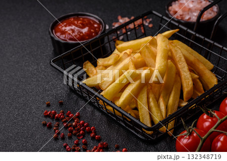 French fries, chips or snack with sauce as food background. French fries 132348719