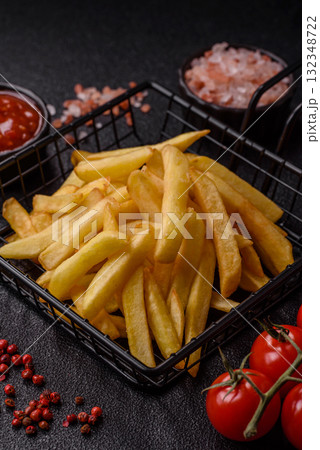 French fries, chips or snack with sauce as food background. French fries 132348722