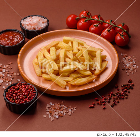 French fries, chips or snack with sauce as food background. French fries 132348745