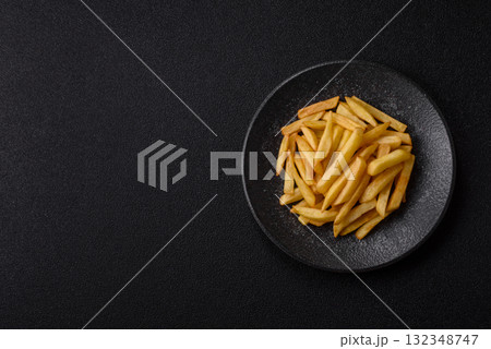 French fries, chips or snack with sauce as food background. French fries 132348747