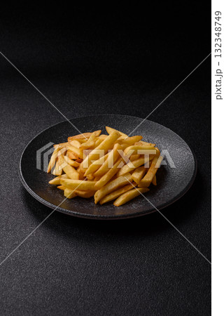 French fries, chips or snack with sauce as food background. French fries 132348749
