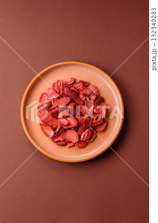 Dried sublimated slices of strawberry as an ingredient for sweet desserts. Dried strawberry 132349283