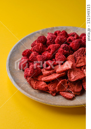 Dried sublimated slices of strawberry and raspberry as an ingredient for desserts. Dried strawberry Dried sublimated slices of strawberry and raspberry as an ingredient for desserts. Dried strawberry 132349315