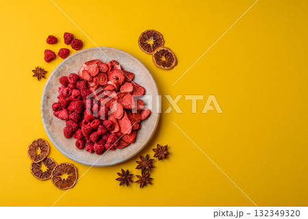 Dried sublimated slices of strawberry and raspberry as an ingredient for desserts. Dried strawberry 132349320