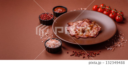 Cooked crispy fried pork bacon strips for a hearty breakfast. Fried bacon strips Cooked crispy fried pork bacon strips for a hearty breakfast. Fried bacon strips 132349488