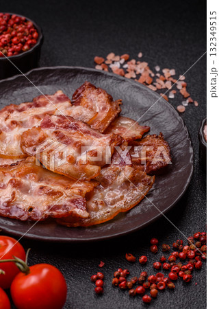 Cooked crispy fried pork bacon strips for a hearty breakfast. Fried bacon strips 132349515