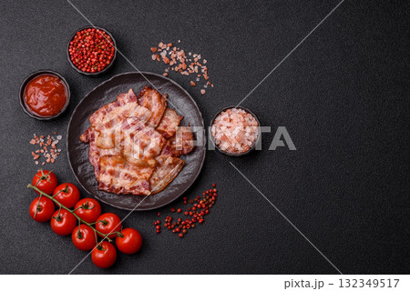 Cooked crispy fried pork bacon strips for a hearty breakfast. Fried bacon strips Cooked crispy fried pork bacon strips for a hearty breakfast. Fried bacon strips 132349517