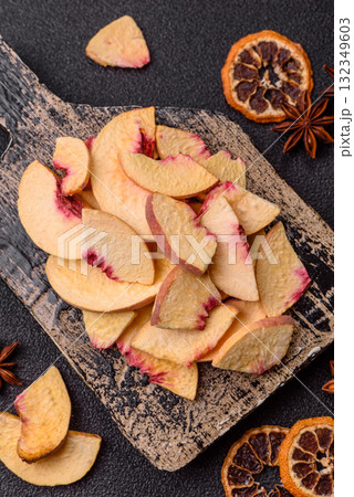Dried sublimated slices of peach or apricot as an ingredient for sweet desserts. Dried peach Dried sublimated slices of peach or apricot as an ingredient for sweet desserts. Dried peach 132349603
