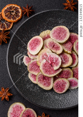 Dried sublimated fig slices as an ingredient for sweet desserts. Dried figs Dried sublimated fig slices as an ingredient for sweet desserts. Dried figs 132349615