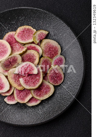 Dried sublimated fig slices as an ingredient for sweet desserts. Dried figs Dried sublimated fig slices as an ingredient for sweet desserts. Dried figs 132349619
